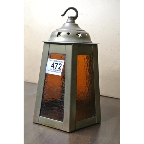 472 - A brass lantern with coloured glass panels