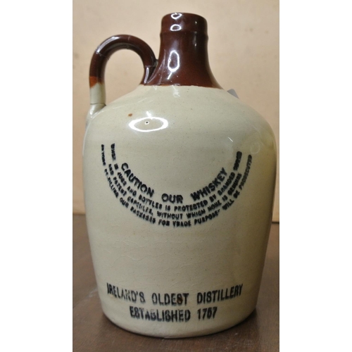 476 - A stoneware whiskey bottle which read 'Locke's Kilbeggan Irish Whiskey. John Lockes & Cold. Kilbegga... 