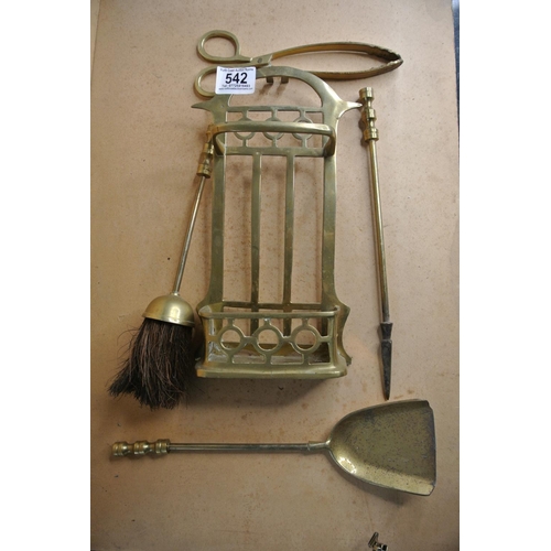 542 - A brass fireside companion set.