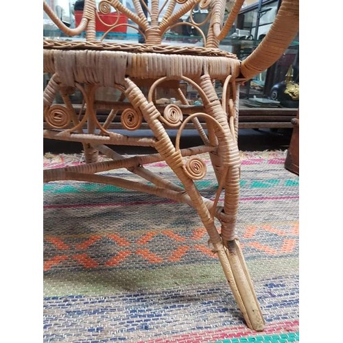 383B - A stunning vintage rattan peacock/throne chair.