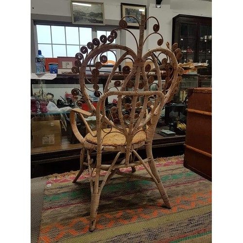 383B - A stunning vintage rattan peacock/throne chair.