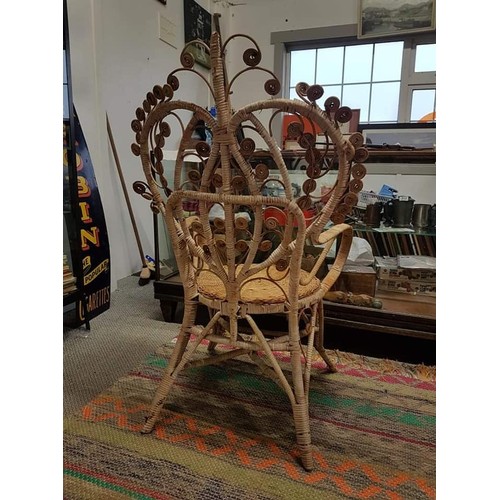 383B - A stunning vintage rattan peacock/throne chair.