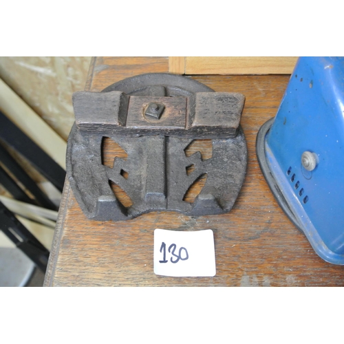 130 - A decorative cast iron trivet.