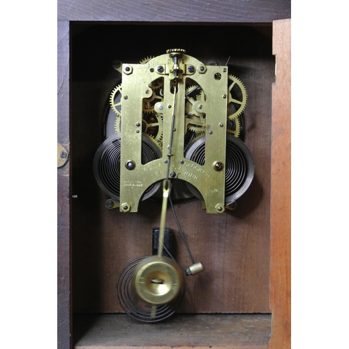 132 - A decorative antique clock with striking movement.