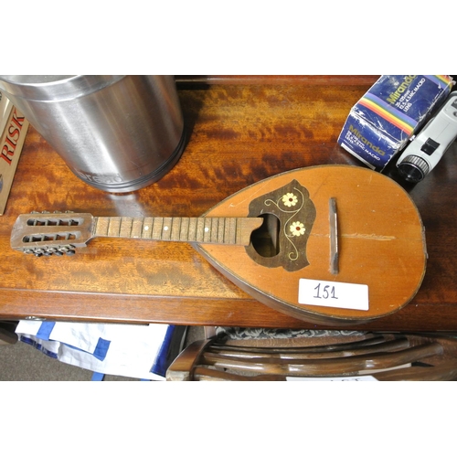 151 - A vintage wooden mandolin.