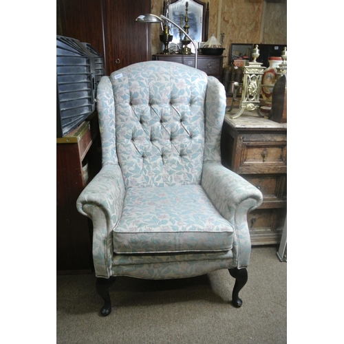 220 - A stunning antique style wingback chair with decorative button back upholstery.