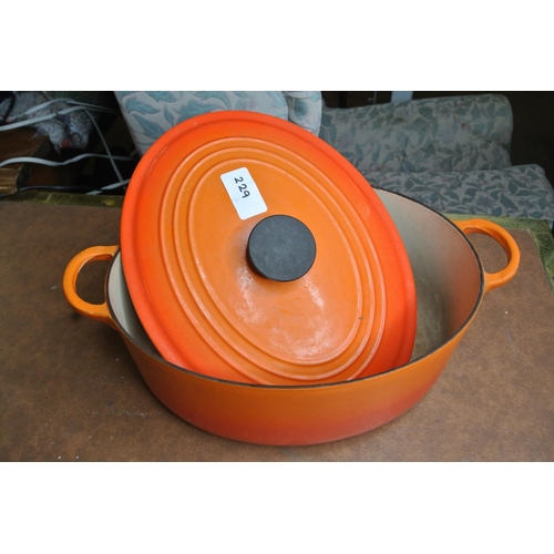 229 - A large Le Creuset lidded cast iron caserole dish.