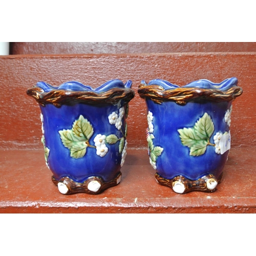 117 - A pair of decorative jugs.