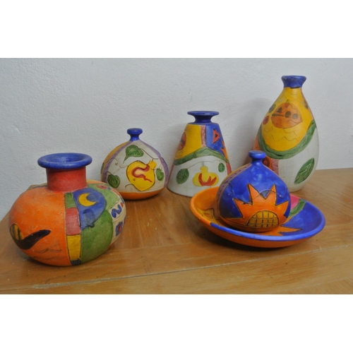 176 - A lot of various brightly coloured handcrafted pottery