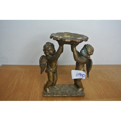 190 - A brass Cherub candle holder a/f