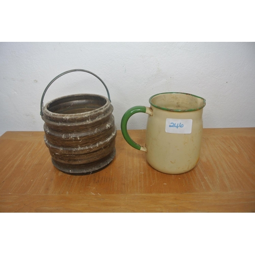 246 - An enamel cream and green jug and a biscuit barrell