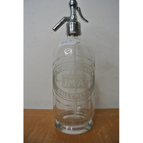 307 - A vintage glass soda syphon with 'J.McAlister and sons Ballymena' etched on the glass