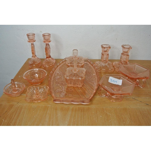 309 - A vintage pink pressed glass dressing table vanity set.