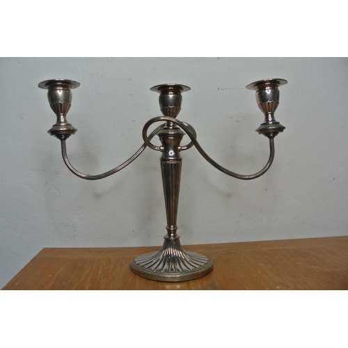 323 - A pair of antique style silver plated double twisted candelabras.