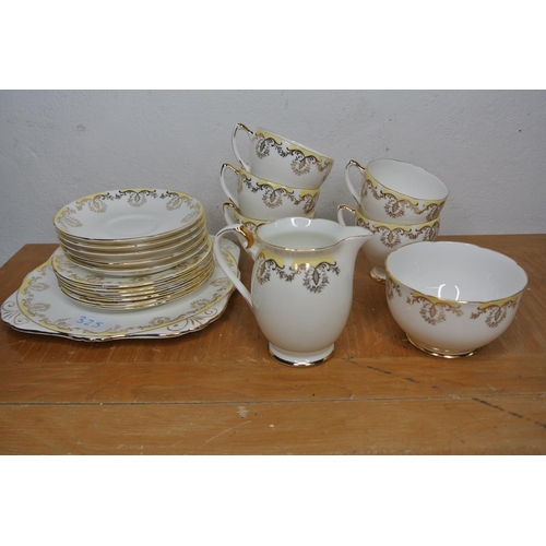 325 - A collection of tea cups, saucers etc produced by Royal Grafton