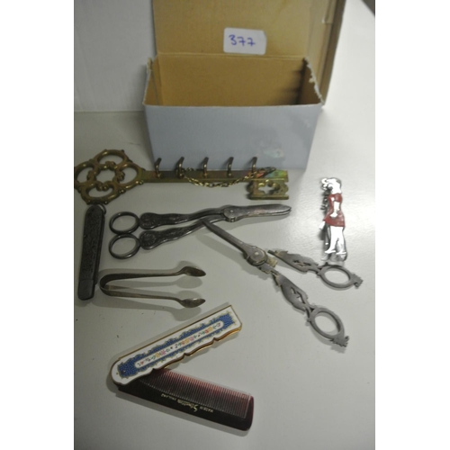 377 - A collection of various to include a vintage comb, scissor, pocket knife and more