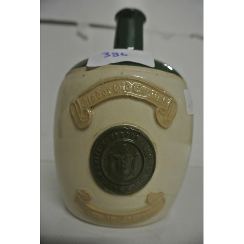 386 - A antique stoneware bottle reading 'Eau de Cologne'