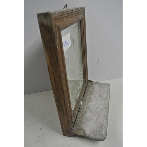 434 - An antique framed bathroom mirror with folding shelf