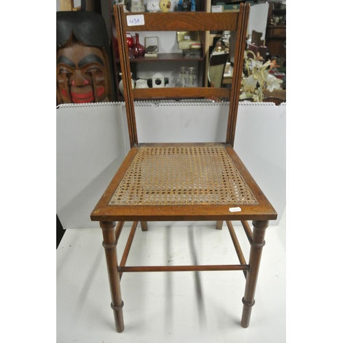 438 - An antique chair with woven seat