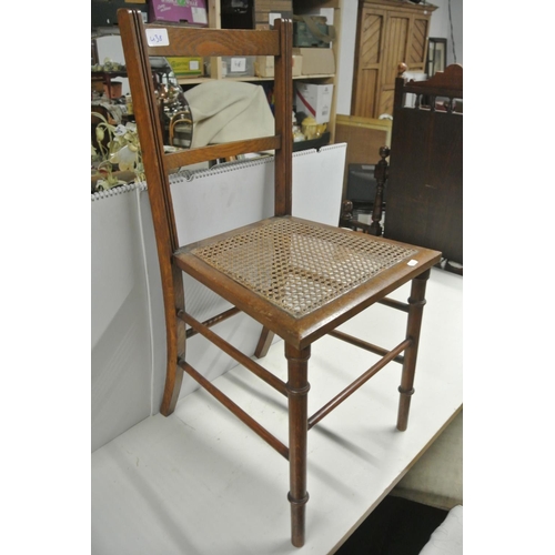 438 - An antique chair with woven seat