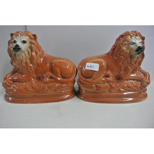 441 - An antique pair of Staffordshire mantle lions (one lion is missing its eyes)