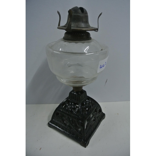 442 - A vintage oil lamp reservoir on cast iron base, 'Young's Comet Burner'