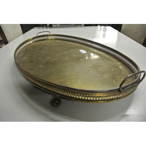 461 - A large antique brass serving tray on on claw feet