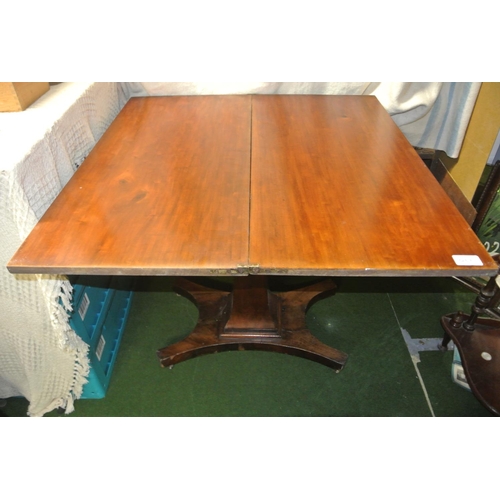 462 - An antique pedestal fold-over tea table