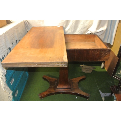 462 - An antique pedestal fold-over tea table