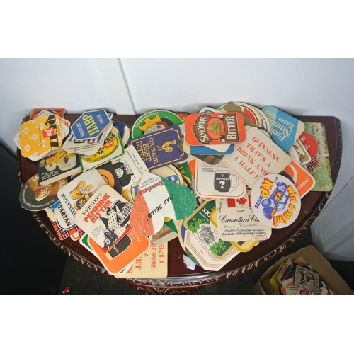 11 - A large collection of vintage pub beermats including Old Bushmills, Harp, Paddy etc.