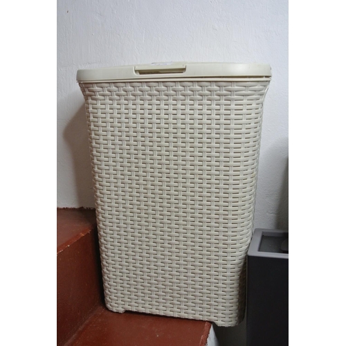 112 - A modern laundry hamper.