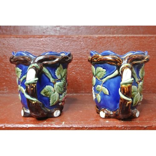 117 - A pair of decorative jugs.