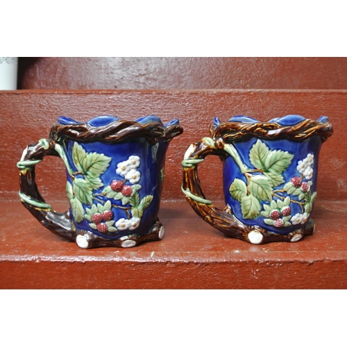 117 - A pair of decorative jugs.