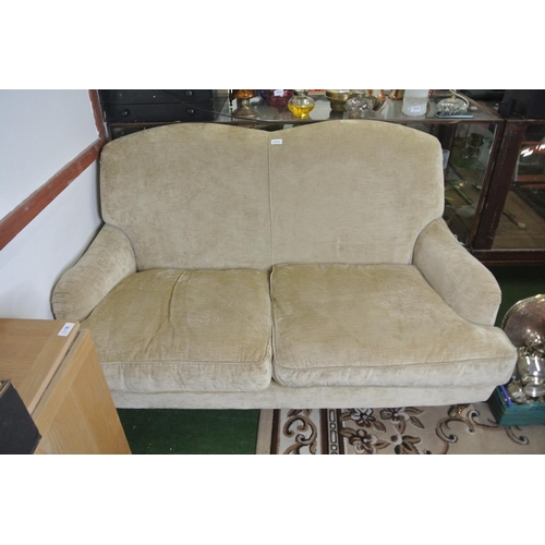 120 - A two seater fabric settee on casters