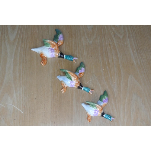 125 - Three ceramic wall hanging ducks stamped by maker on back. (a/f)