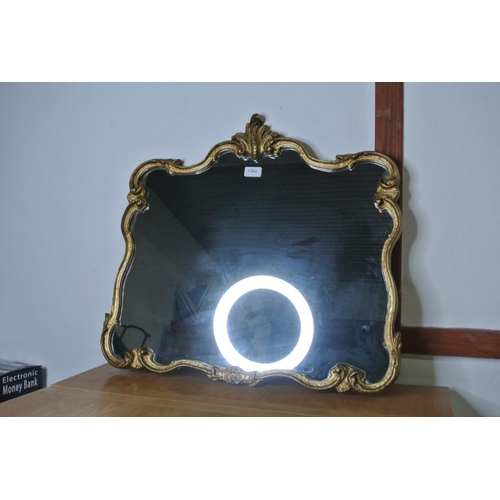 126 - A stunning antique style decorative edged wall mirror with gilt detail