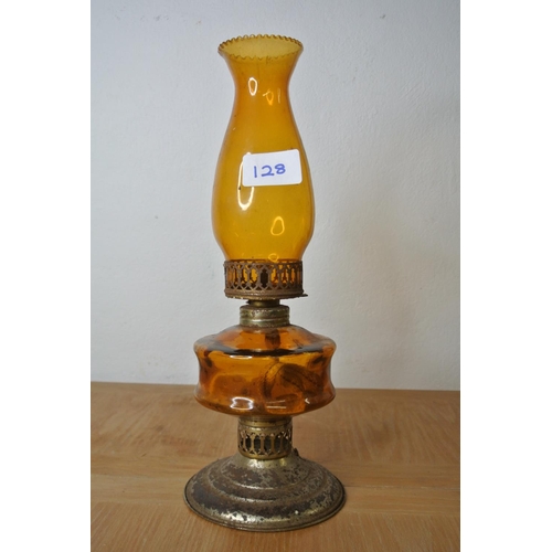 128 - An amber oil lamp