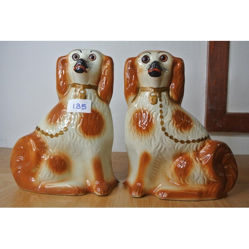 135 - A pair of antique Staffordshire dogs with glass eyes