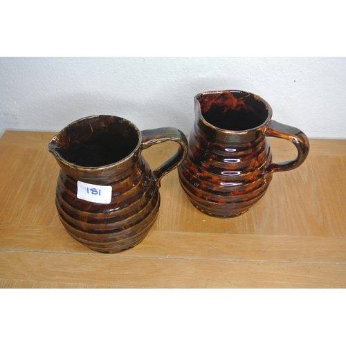 181 - A pair of water jugs