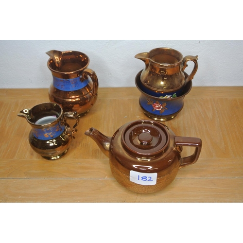 182 - A lustre ware teapot a/f, two jugs and bowl