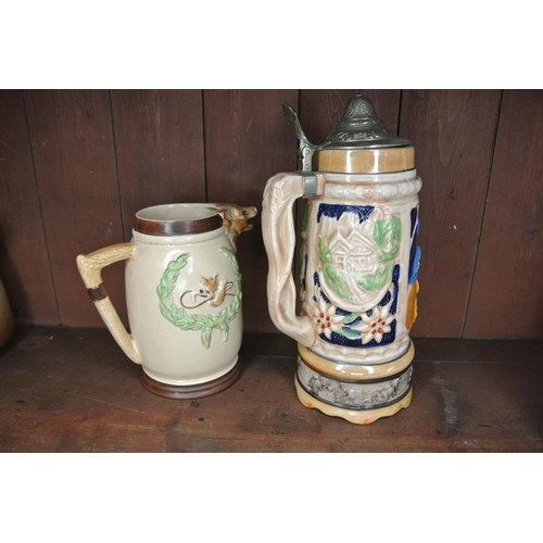 184 - A musical lidded tankard and a hunting jug