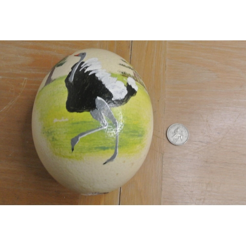 203 - A hand painted Ostrich egg