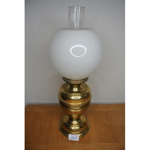 241 - A brass based oil lamp and milk glass shade, converted to gas.