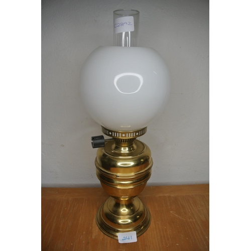 241 - A brass based oil lamp and milk glass shade, converted to gas.