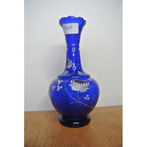 245 - A Bristol blue glass vase with flower detail