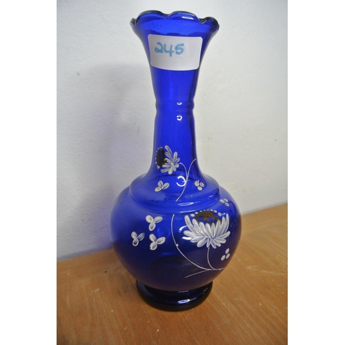 245 - A Bristol blue glass vase with flower detail