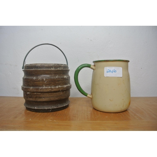 246 - An enamel cream and green jug and a biscuit barrell