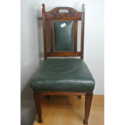 265 - A mahogany carved leather upholstered chair