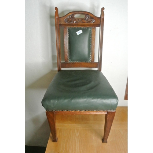 265 - A mahogany carved leather upholstered chair