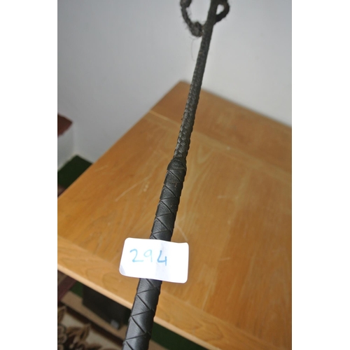 294 - An antique carriage driver's bow top horse whip.